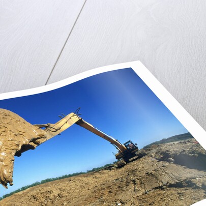 Backhoe Working in Muddy Field by Anonymous