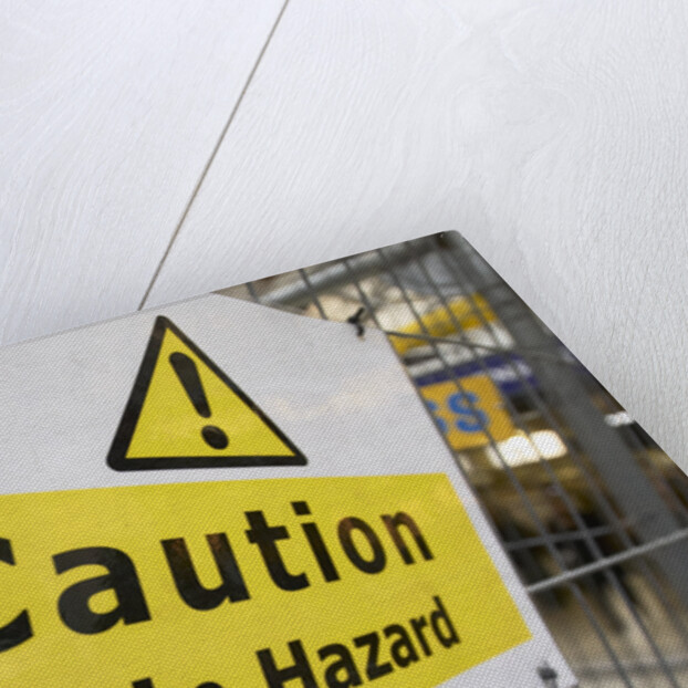 Caution Trip Hazard Sign on Construction Site by Anonymous