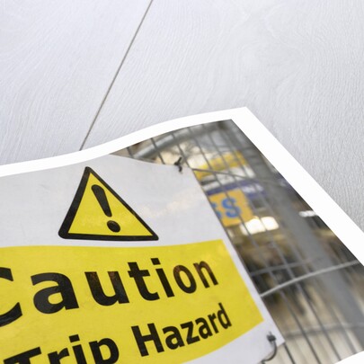 Caution Trip Hazard Sign on Construction Site by Anonymous