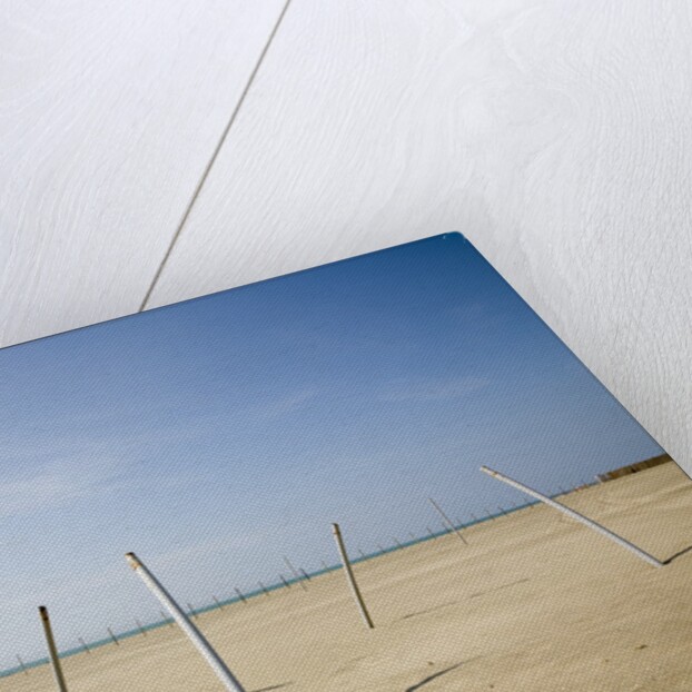Bent Poles on the Beach by Jim Vecchi