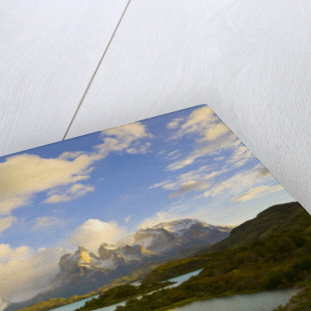 Mountains Shrouded in Clouds near Lake by Anonymous