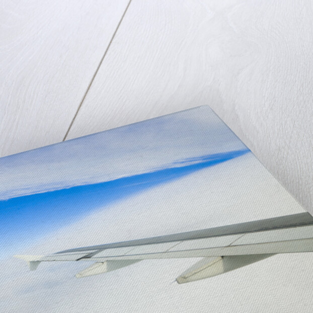 Airplane Wing Above Clouds by Anonymous