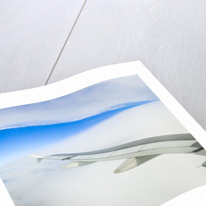 Airplane Wing Above Clouds by Anonymous