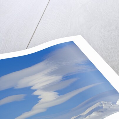 Lenticular Clouds Floating above Snow-covered Glacier by Anonymous
