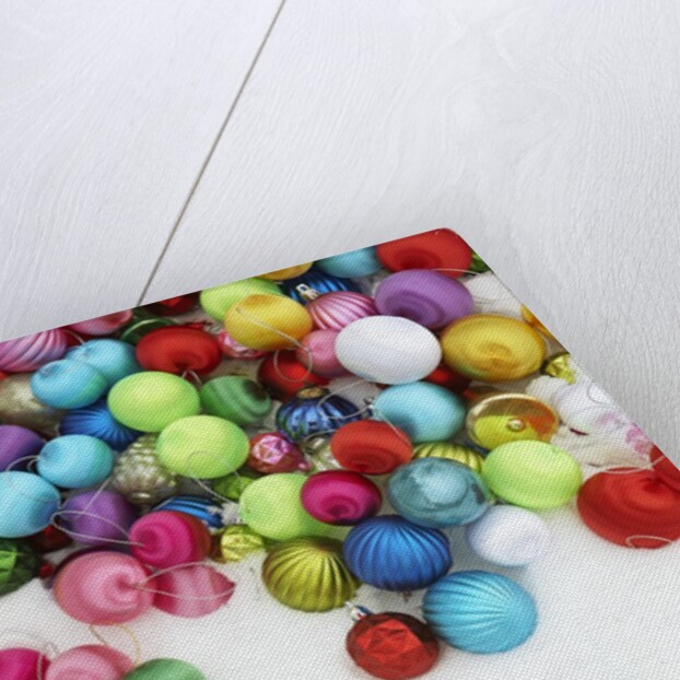 Christmas ornaments on snow by Anonymous