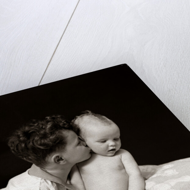 1940s Curly Haired Boy Toddler Leaning And Kissing Cute Baby by Anonymous