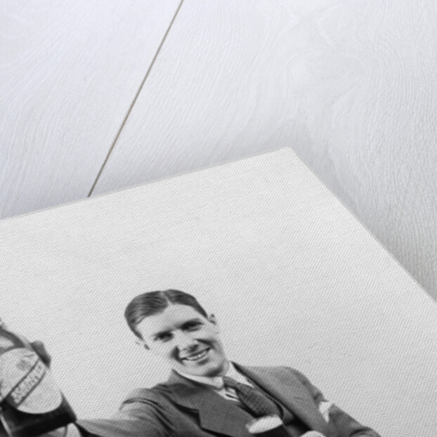 1920s 1930s Man Holding Up Huge Distorted Beer Bottle In One Hand And A Regular Size Glass Of Beer In Other by Anonymous