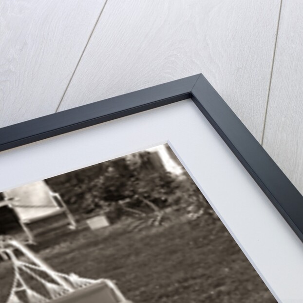 1950s Relaxed Boy Lying In Suburban Backyard Hammock by Anonymous