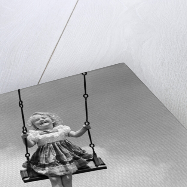 1950s Laughing Little Girl Swinging High On Outdoor Swing by Anonymous
