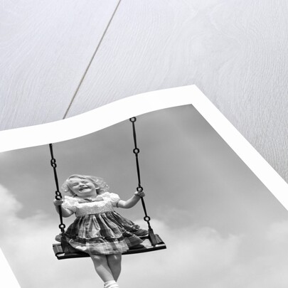 1950s Laughing Little Girl Swinging High On Outdoor Swing by Anonymous