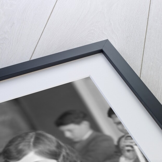 1920s School Girl Eating Lunch At Her Desk Drinking From A Bottle Of Milk Holding A Sandwich by Anonymous