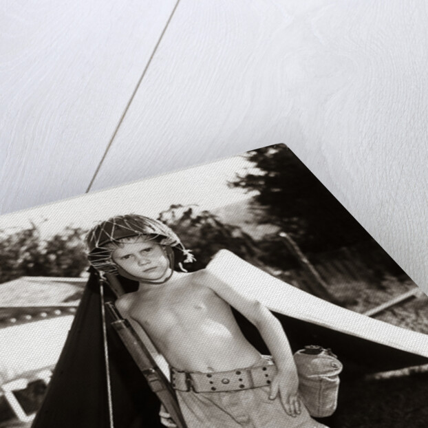 1950s Boy Playing Soldier Standing With Rifle Helmet Canteen Tent by Anonymous