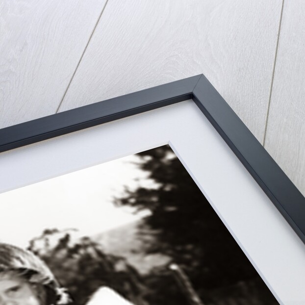 1950s Boy Playing Soldier Standing With Rifle Helmet Canteen Tent by Anonymous