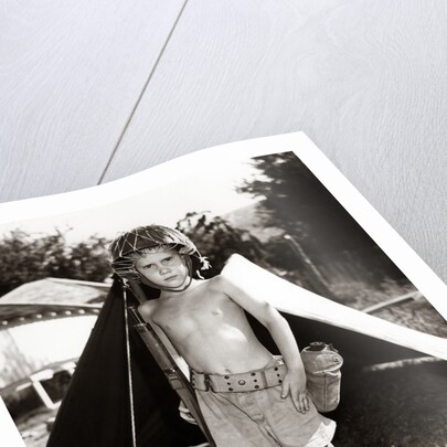 1950s Boy Playing Soldier Standing With Rifle Helmet Canteen Tent by Anonymous