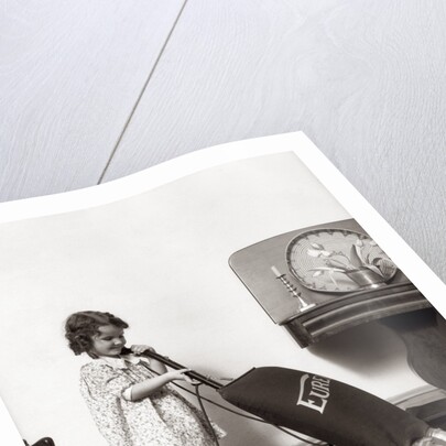 1930s Little Girl Vacuuming With Eureka Electric Vacuum Cleaner by Anonymous