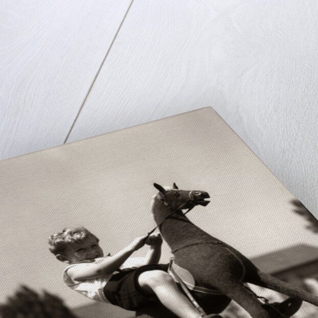 Little Boy on Rocking Horse Toy by Anonymous