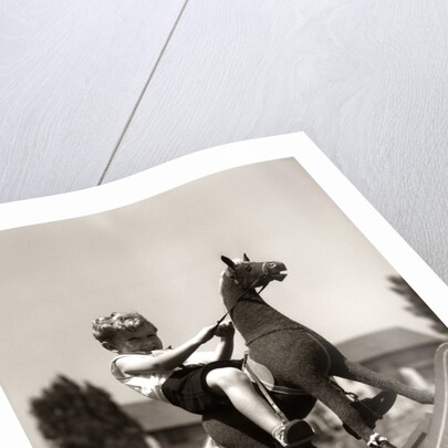 Little Boy on Rocking Horse Toy by Anonymous