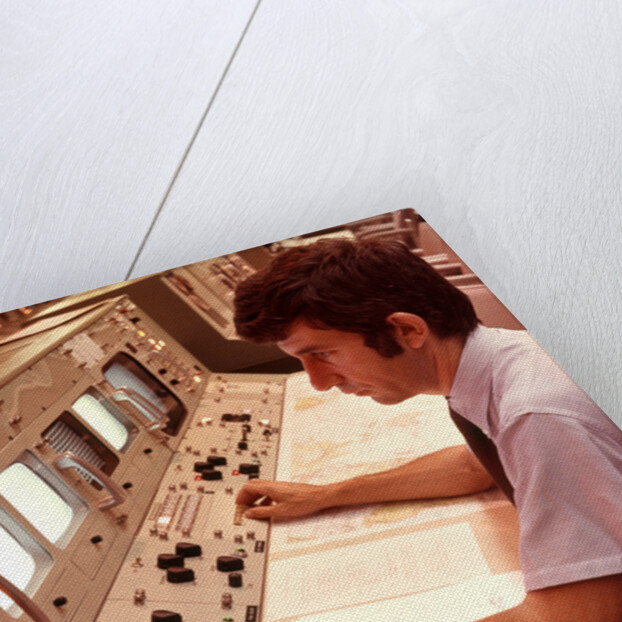 1970s Man Sitting At Control Panel Of NASA Mission Control by Anonymous
