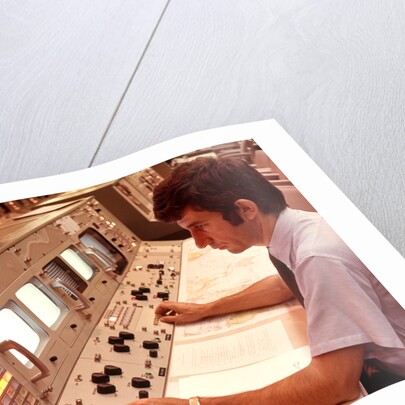 1970s Man Sitting At Control Panel Of NASA Mission Control by Anonymous