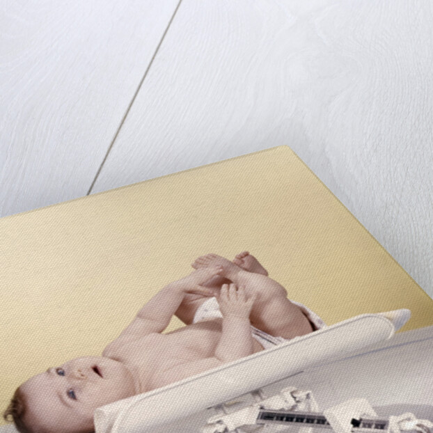 1950s 1960s Baby Lying On Weight Scale by Anonymous