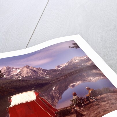 1970s Elderly Couple Camping Sitting By Red Tent Stanley Lake Idaho by Anonymous