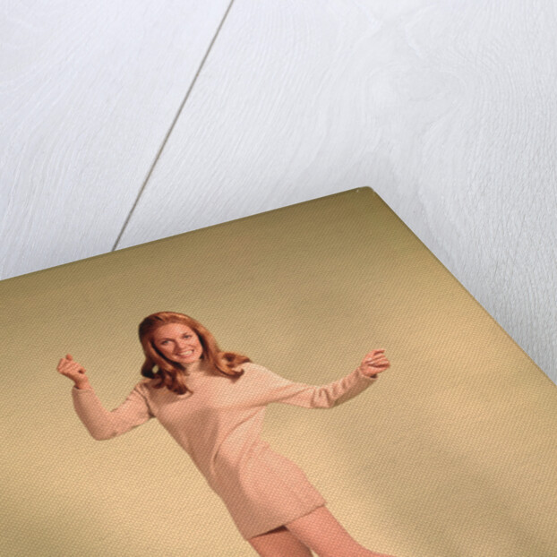 1960s Woman Dancer In Tan Dress And Boots White Fishnet Stockings by Anonymous