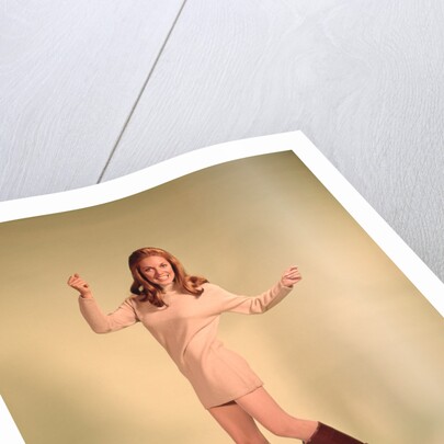 1960s Woman Dancer In Tan Dress And Boots White Fishnet Stockings by Anonymous