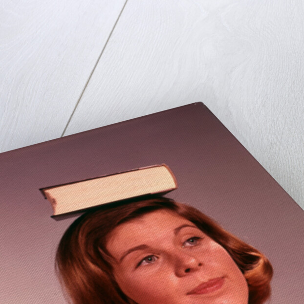 1960s 1970s Young Woman Girl Balancing Book On Head by Anonymous