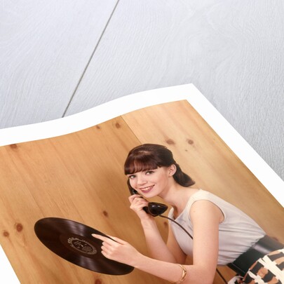 1950s Teenage Girl Talking On Telephone And Holding LP Record by Anonymous