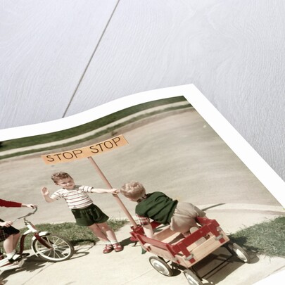 1950s Boys And Girls Outdoor With Tricycle And Wagon Playing Traffic With Police Stop Sign Americana by Anonymous
