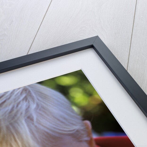 1980s Boy Using Magnifying Glass by Anonymous