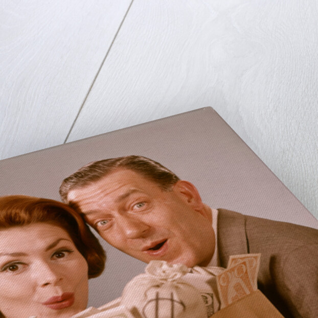 1960s Surprised Happy Couple Man Woman With Grocery Bag Filled With Money by Anonymous