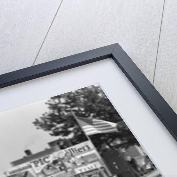 1940s Boy Sitting At Corner Newsstand Writing In Notepad by Anonymous