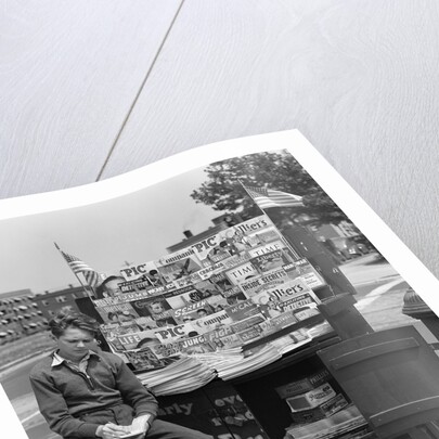 1940s Boy Sitting At Corner Newsstand Writing In Notepad by Anonymous