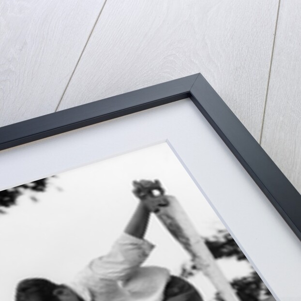 1930s Pair Of Boys Building Shack One Nailing Board To Side One On Roof With Saw by Anonymous