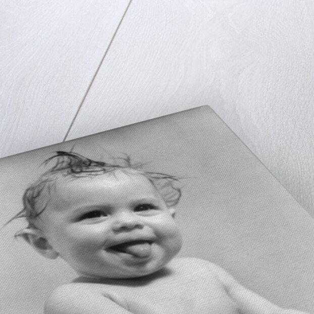 1940s 1930s Wet Baby Sitting In Tub Sticking Out Tongue by Anonymous