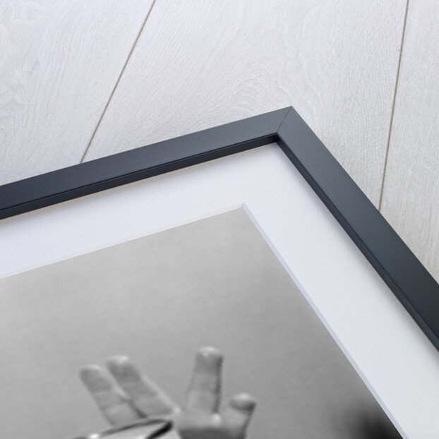 1950s Toddler Reaching Up To Table To Grab Milk Glass by Anonymous