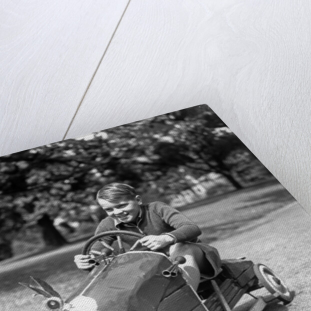 1930s Boy Driving Home Built Race Car Holding Steering Wheel by Anonymous