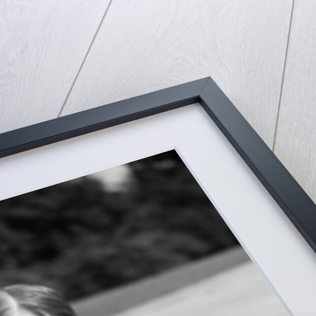 1930s Boy Fastening Metal Roller Skates by Anonymous