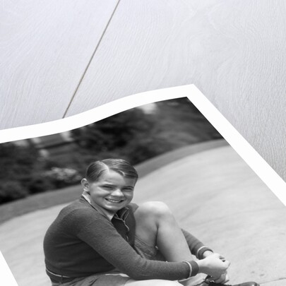 1930s Boy Fastening Metal Roller Skates by Anonymous