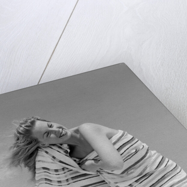 1950s 1960s Woman Wrapped In Stripped Towel Drying Hair On Beach Smiling by Anonymous
