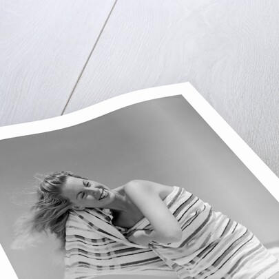 1950s 1960s Woman Wrapped In Stripped Towel Drying Hair On Beach Smiling by Anonymous