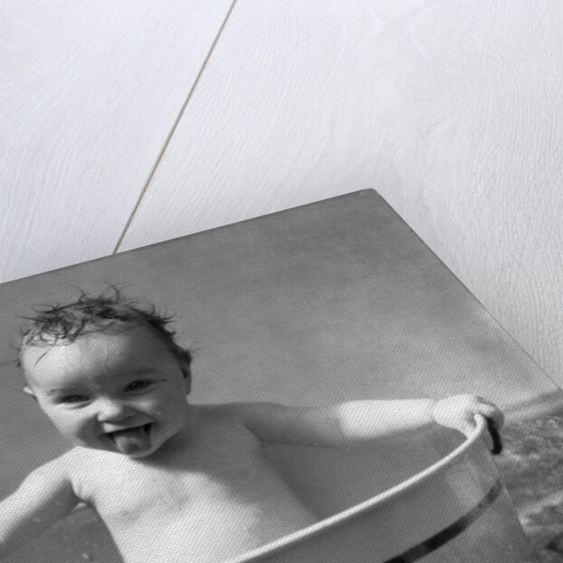 1930s Wet Baby In Washtub Sticking Out Tongue by Anonymous