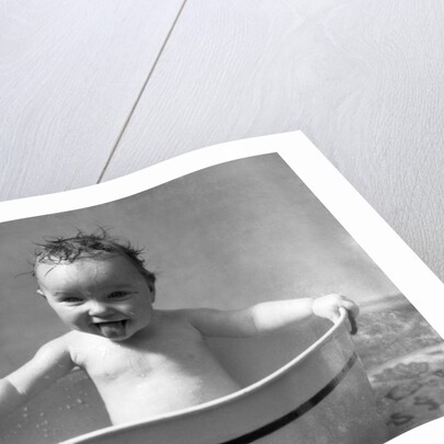 1930s Wet Baby In Washtub Sticking Out Tongue by Anonymous
