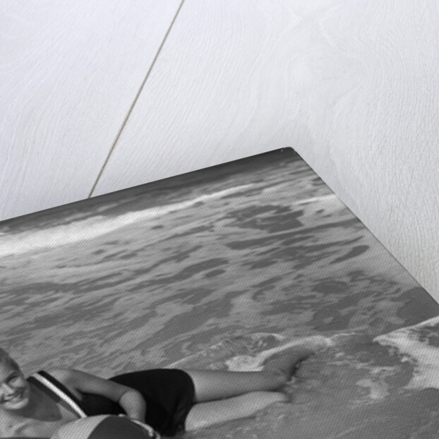 1960s Woman In Bathing Suit Lying In The Surf Holding A Beach Ball Outdoor by Anonymous