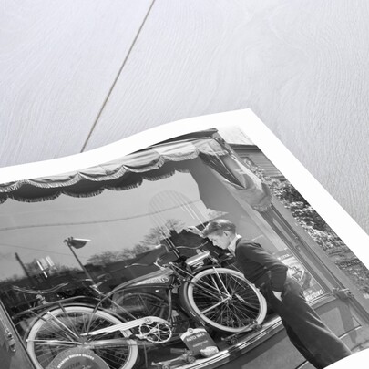 1950s Boy On Sidewalk Looking At Bicycle In Store Window by Anonymous