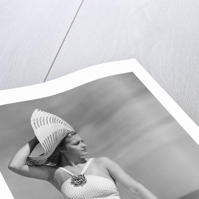 1940s Woman In White Bathing Suit On Beach Wearing Big Straw Hat by Anonymous
