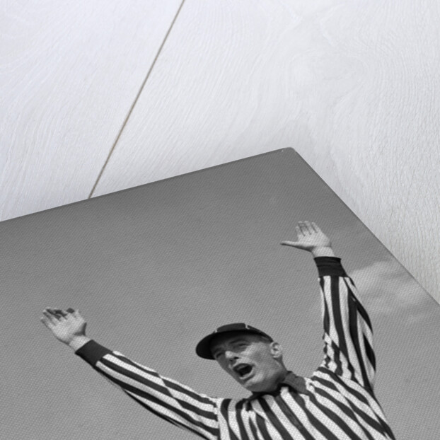 1950s Football Referee Making Touchdown Signal by Anonymous