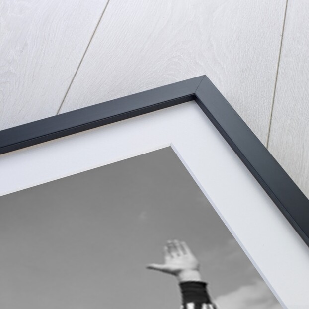 1950s Football Referee Making Touchdown Signal by Anonymous