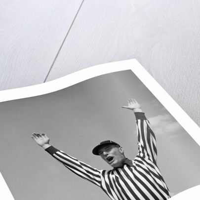 1950s Football Referee Making Touchdown Signal by Anonymous